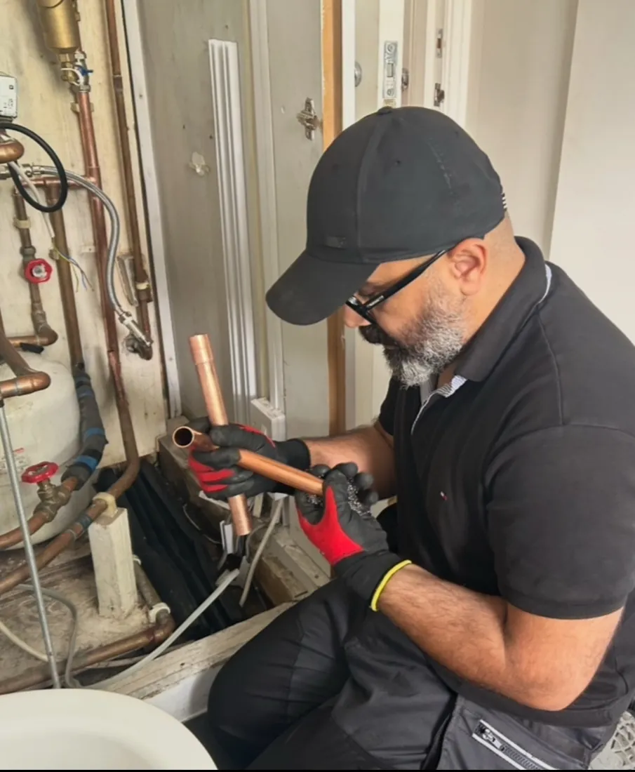 Preparing copper pipework and fittings.